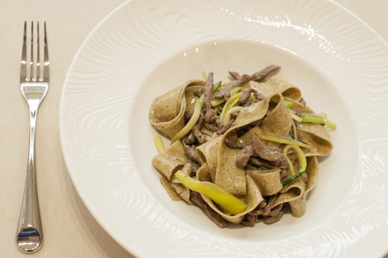 Coffee pasta with veal in cognac sauce
