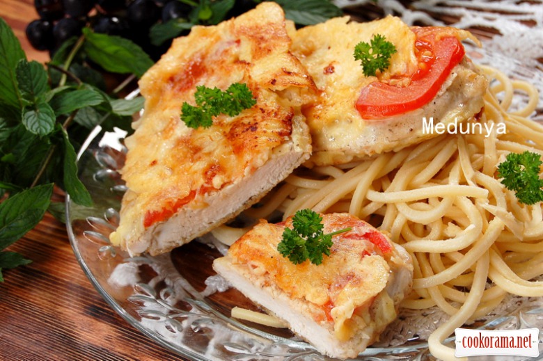 Chicken chop with tomatoes on a pan