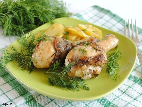 Chicken legs baked with potato