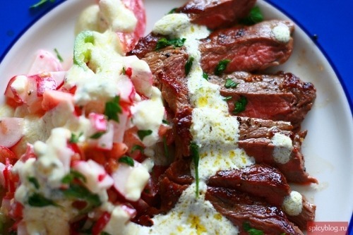 Tomato and radish salad with beef and brynza dressing