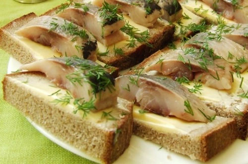 Snack canapes with dill and herring