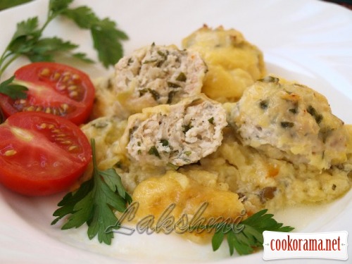 Zucchini casserole with chicken meatballs on grape leaves