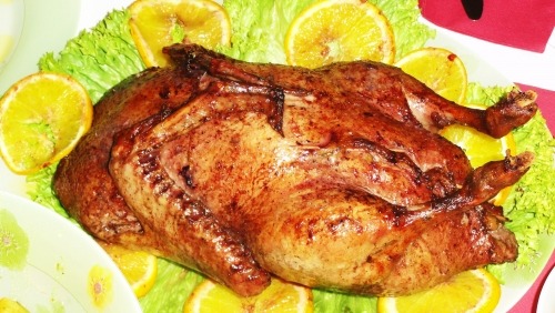 Christmas duck with oranges in wine
