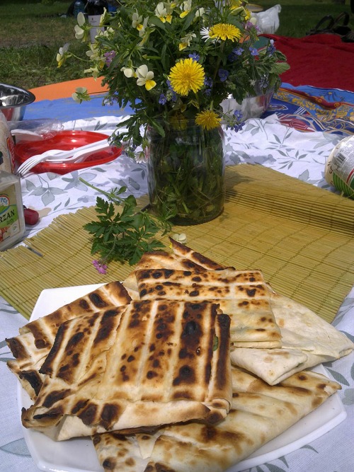 Lavash with brynza and greens on grill