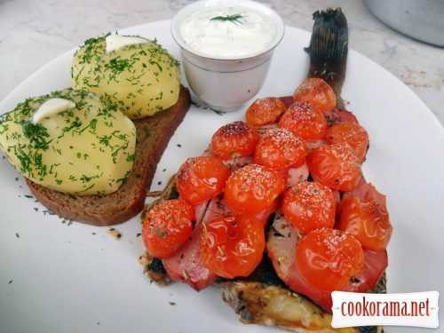 Halibut baked under brisket and cherry tomatoes with white sauce