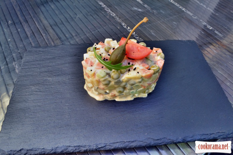 Olivier salad with salmon and spicy sauce